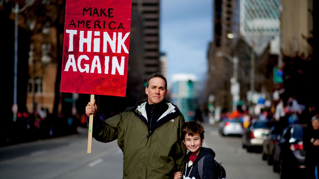 'Make America Think Again' sign.
