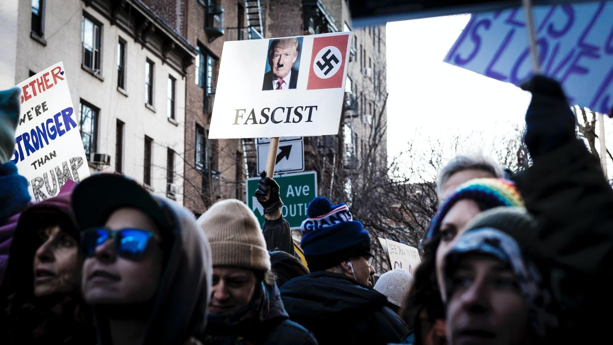 Person holding Donald Trump signage