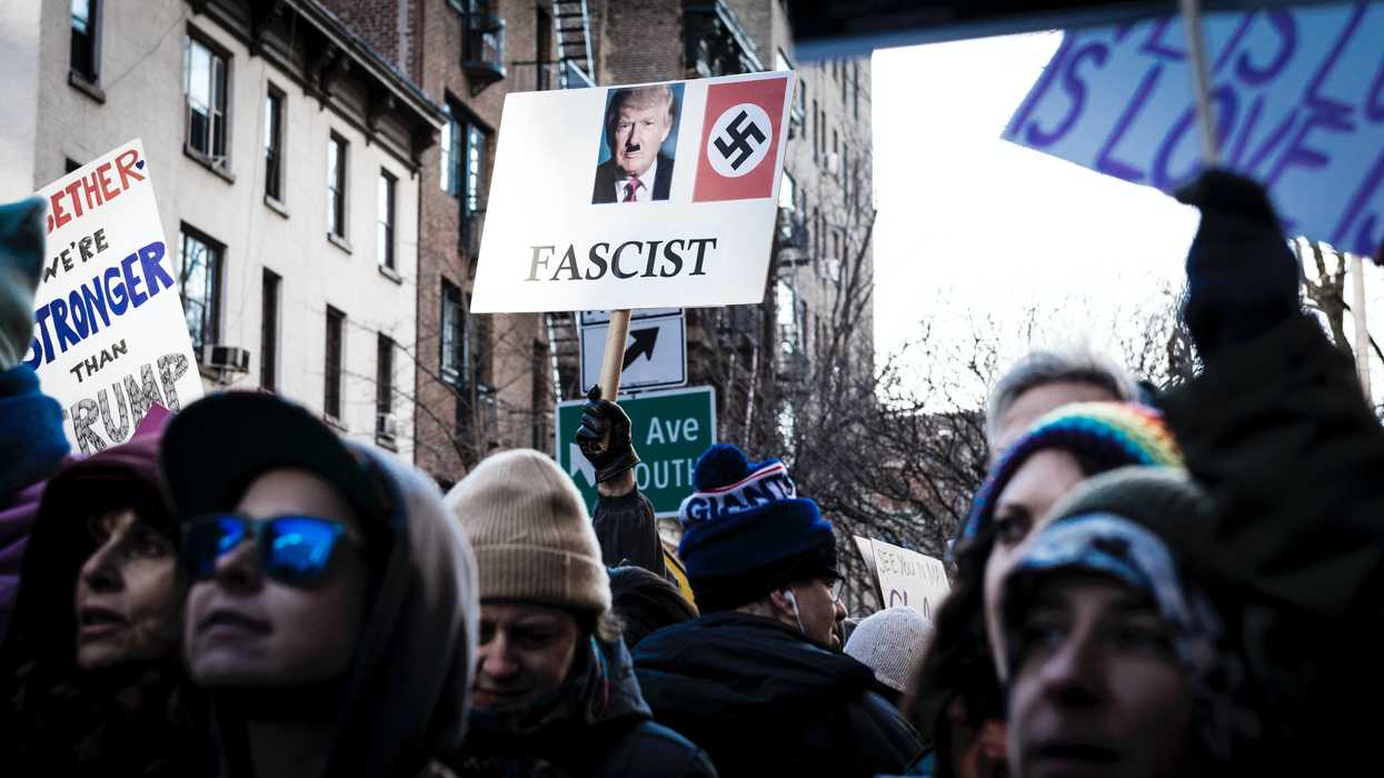Person holding Donald Trump signage