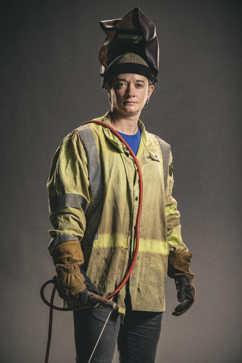 Sarah Burkett holding welding equipment