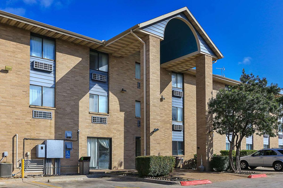 Austinites protested the purchase of a fourth hotel for homeless housing. Neighbors of the first hotel weigh in.