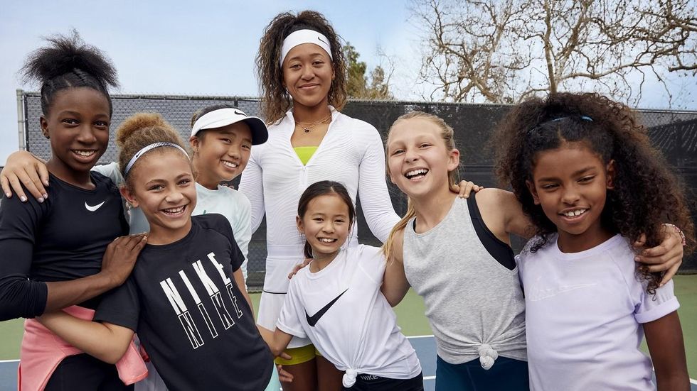 Naomi Osaka gently blessed by a butterfly during her match vs