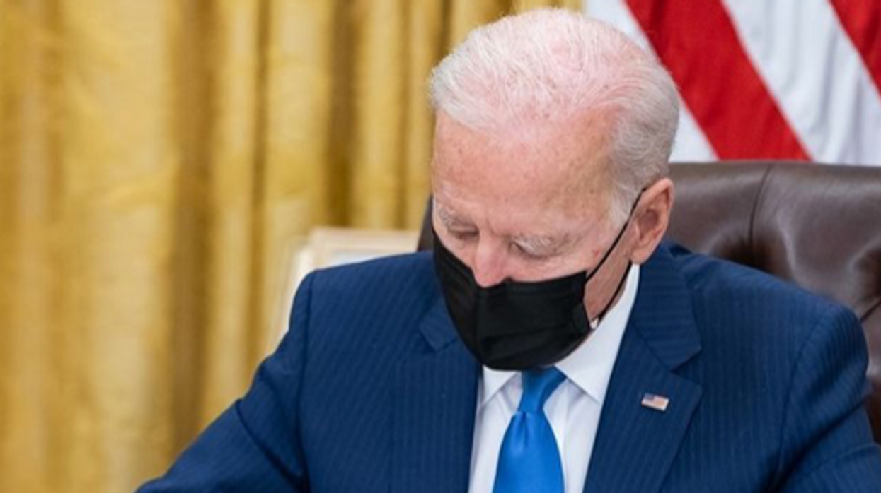 President Joe Biden signing an executive order.