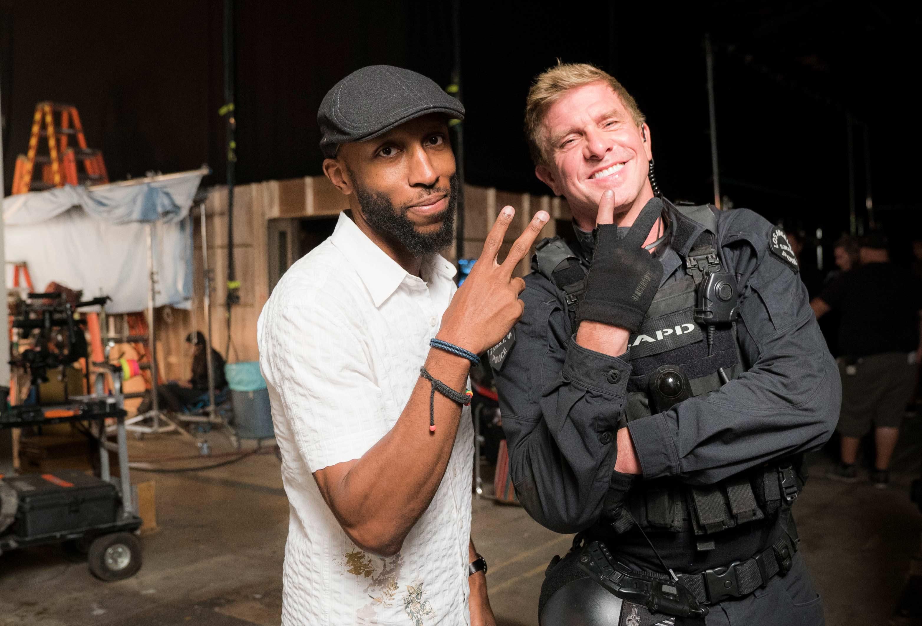 Aaron Rahsaan Thomas and actor Kenny Johnson pose on the SWAT set