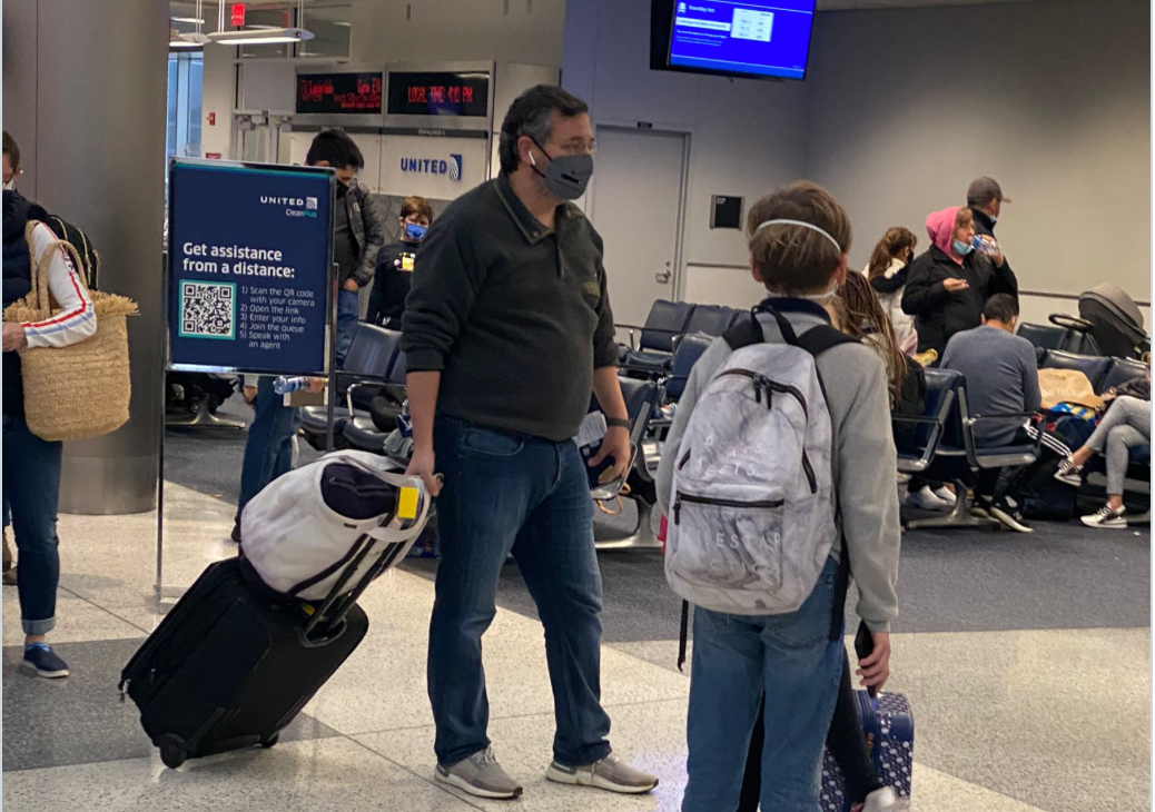 Sen. Ted Cruz preparing to board a flight to Cancun in Huston as his state of Texas faces the aftermath of a severe winter storm. 
