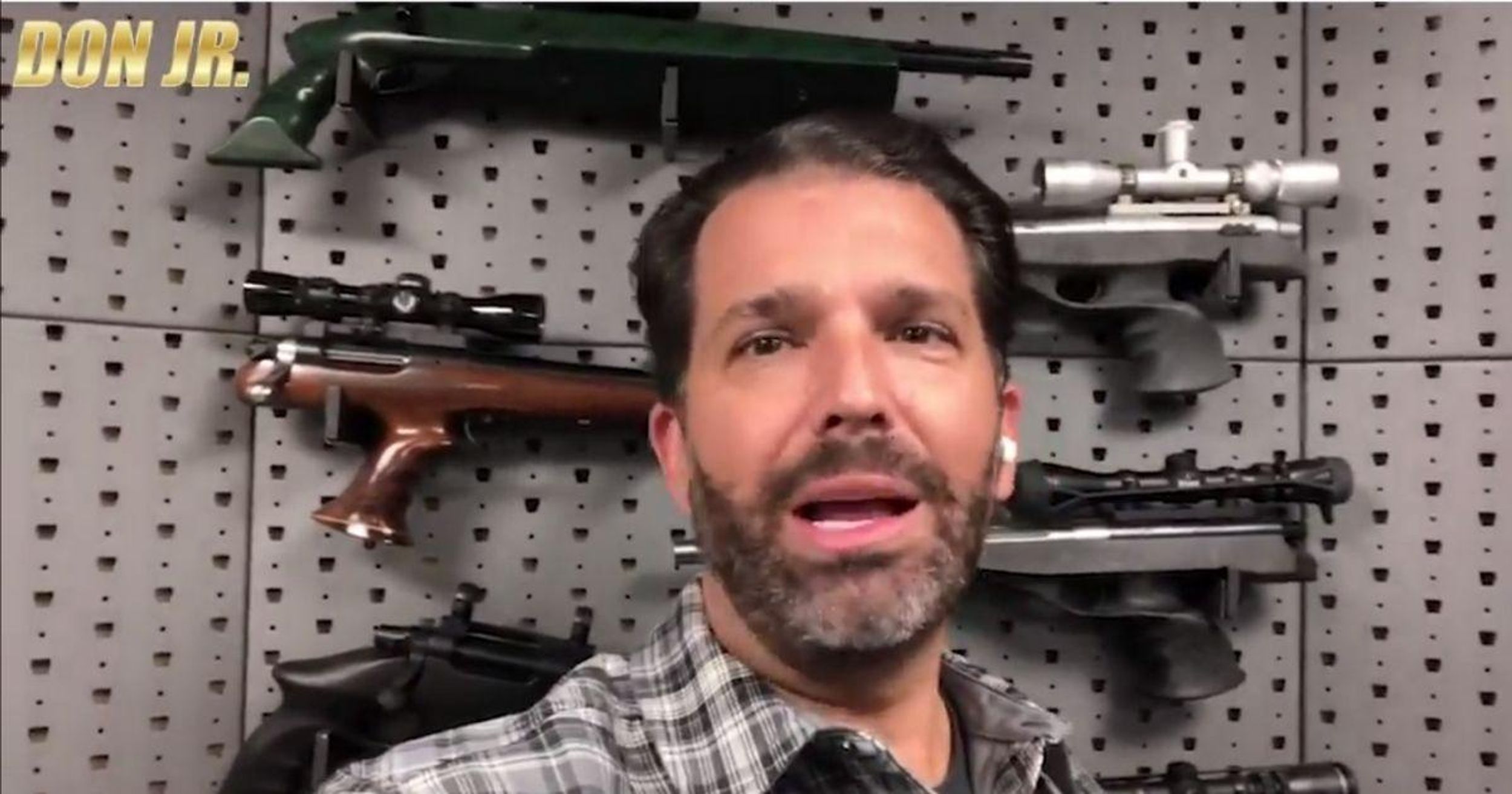 Don Jr. Slammed For Railing Against Teachers Union While Standing In Front Of Wall Of Guns