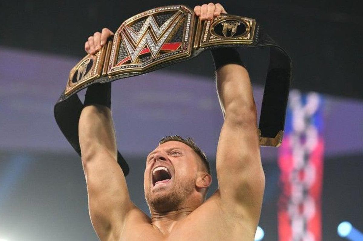 The Miz with holding the WWE Championship over his head in celebrations