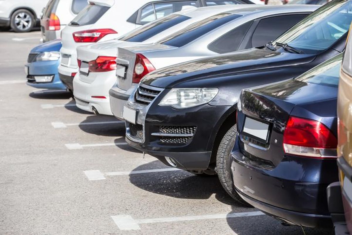 Cars parking in an outdoor parking lot