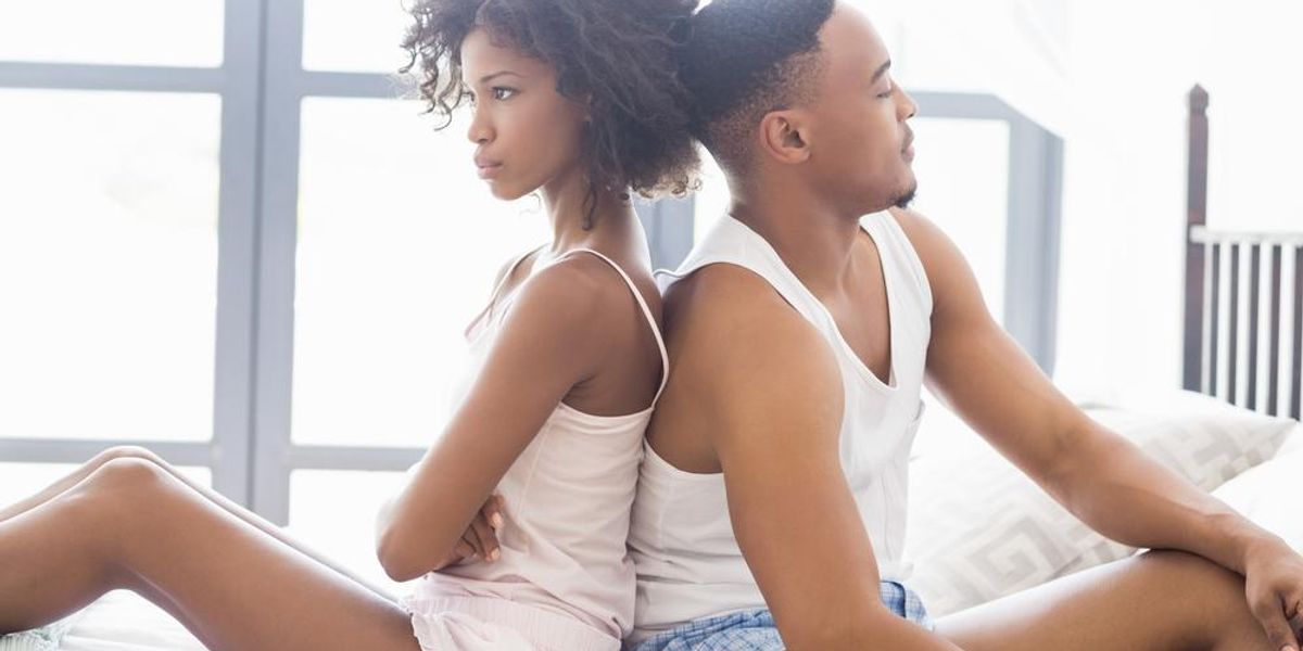 black-couple-in-bed-upset