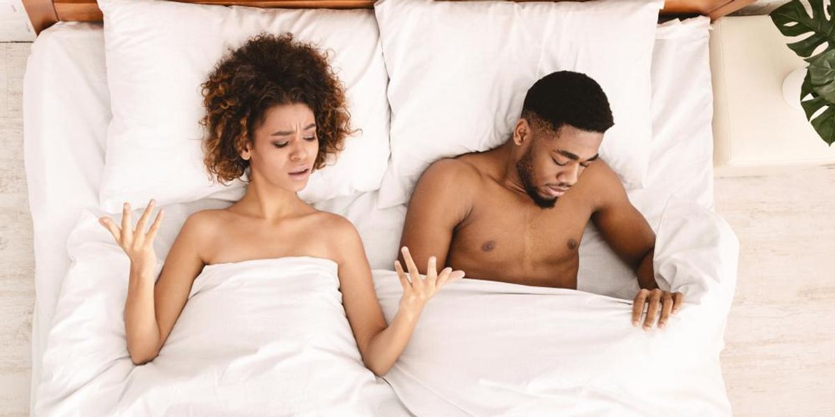 black-couple-in-bed-upset