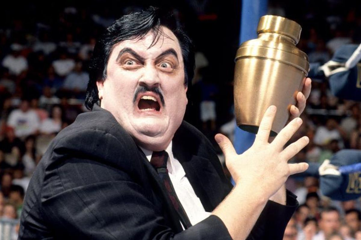 Paul Bearer holding The Undertaker's urn with a ghastly expression on his face