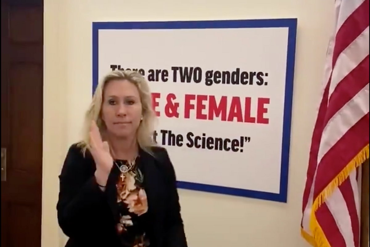 Rep. Marjorie Taylor Greene (R-Ga) puts up transphobic sign outside of her office.