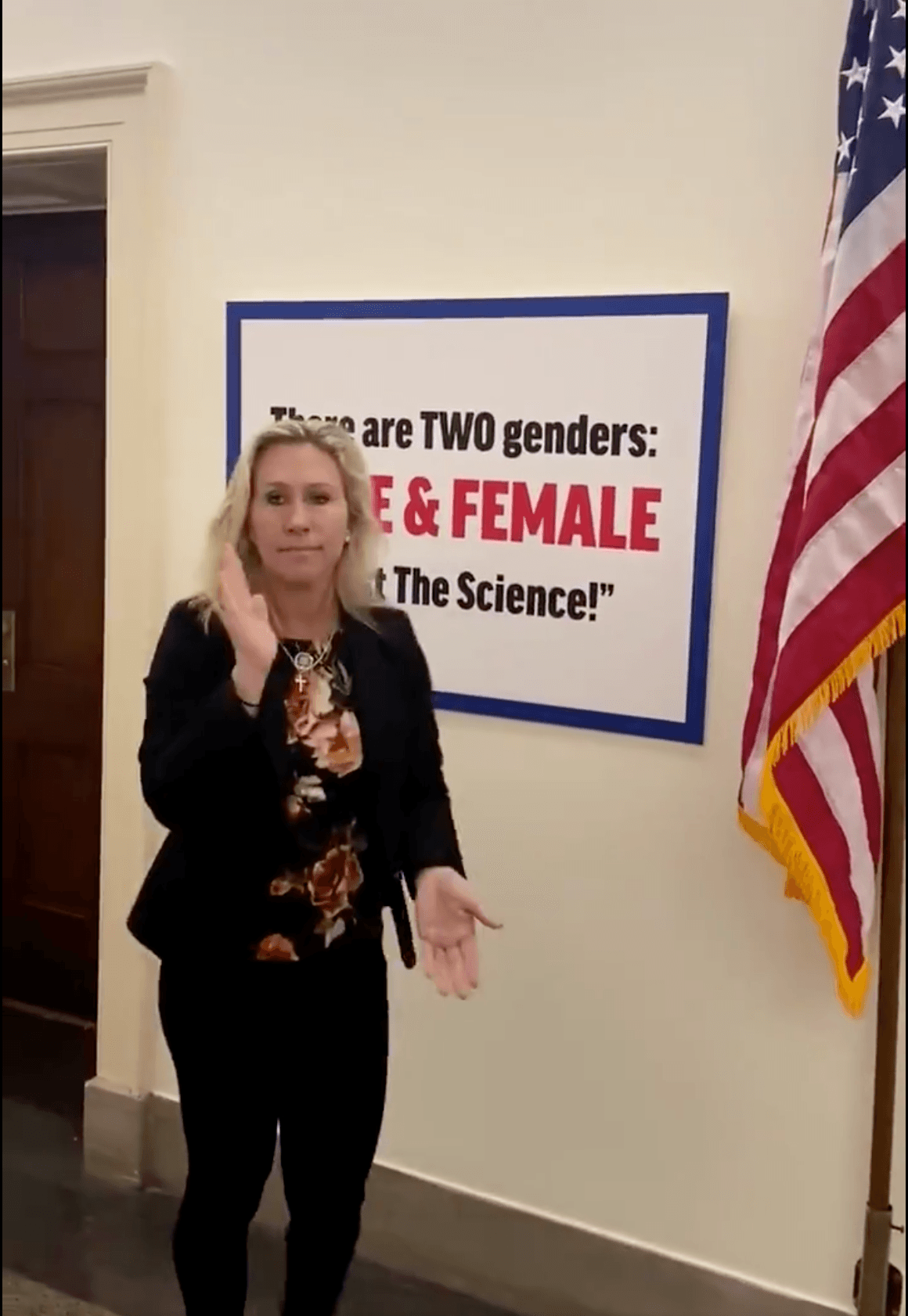 Rep. Marjorie Taylor Greene (R-Ga) puts up transphobic sign outside of her office.