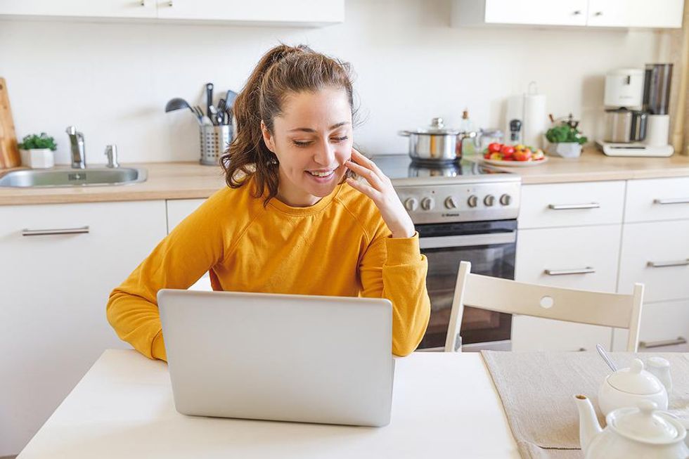 Young woman happy while working from home