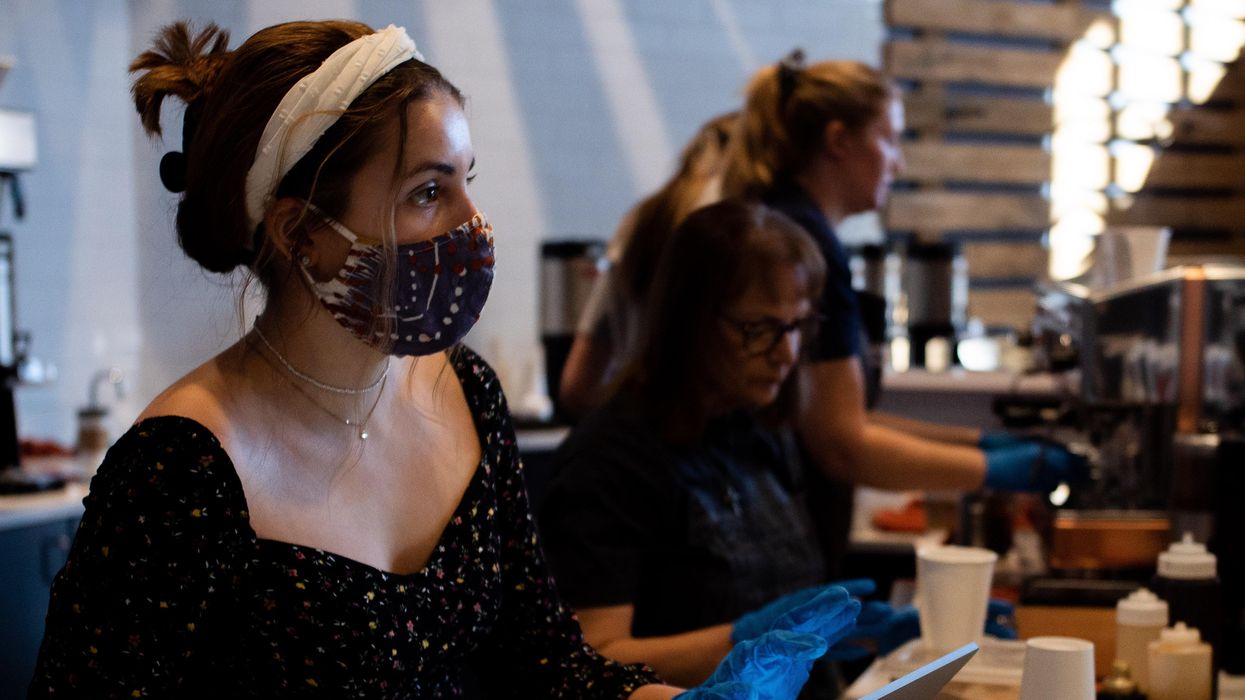 Woman taking orders during Covid-19 pandemic