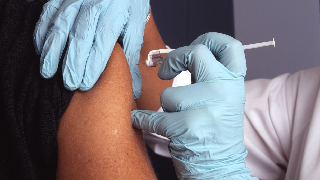 A doctor administering a vaccine.