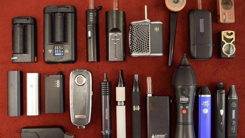Table full of different vaporizers 