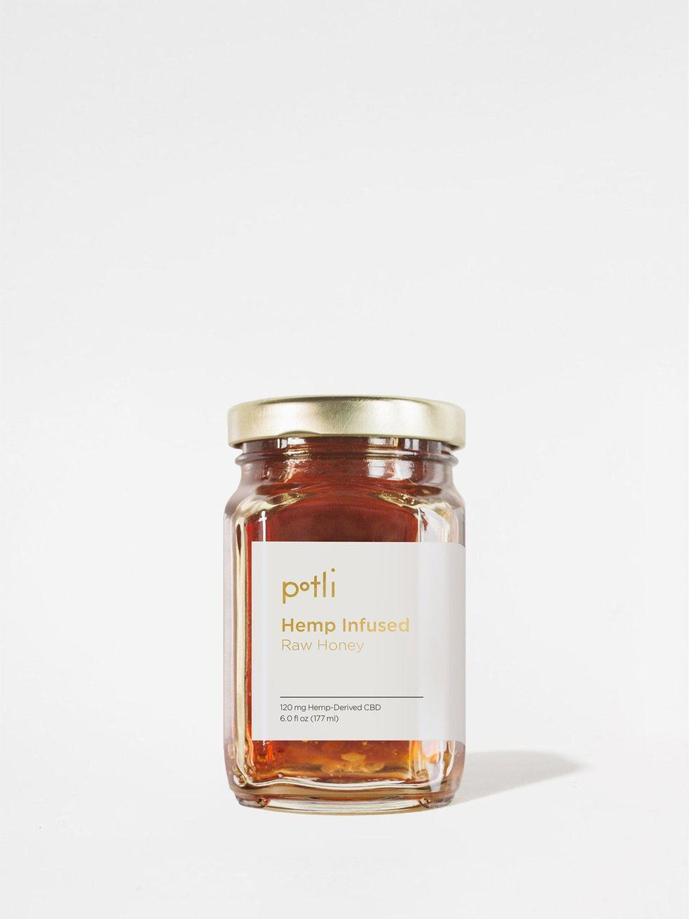 CBD Infused honey displayed on white background