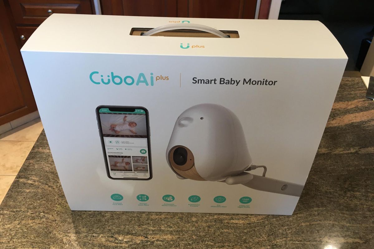 Cubo AI Plus Smart Baby Monitor in a box on a counter.