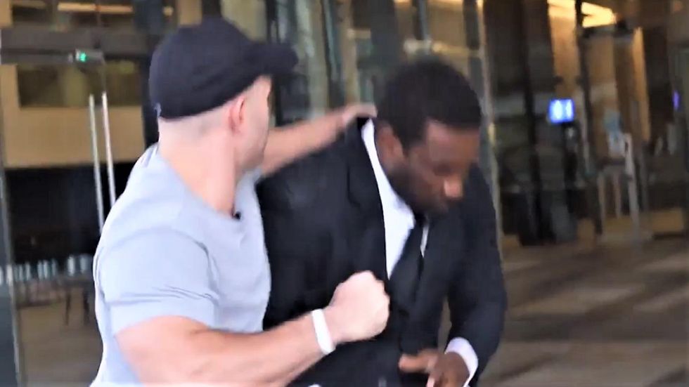 WATCH: Neo-Nazi calls Black security guard a 'monkey' before viciously assaulting him
