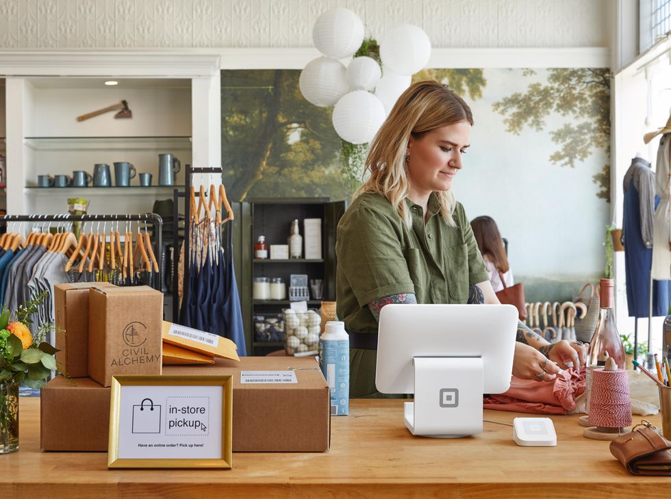 A retailer uses Square technology to take payments.