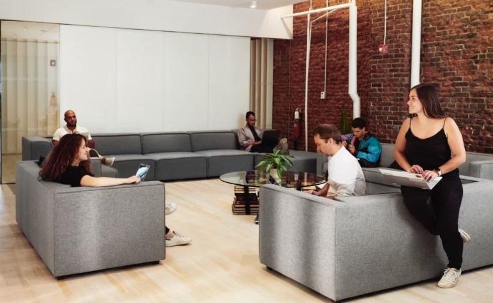 Square employees collaborate in a common area.