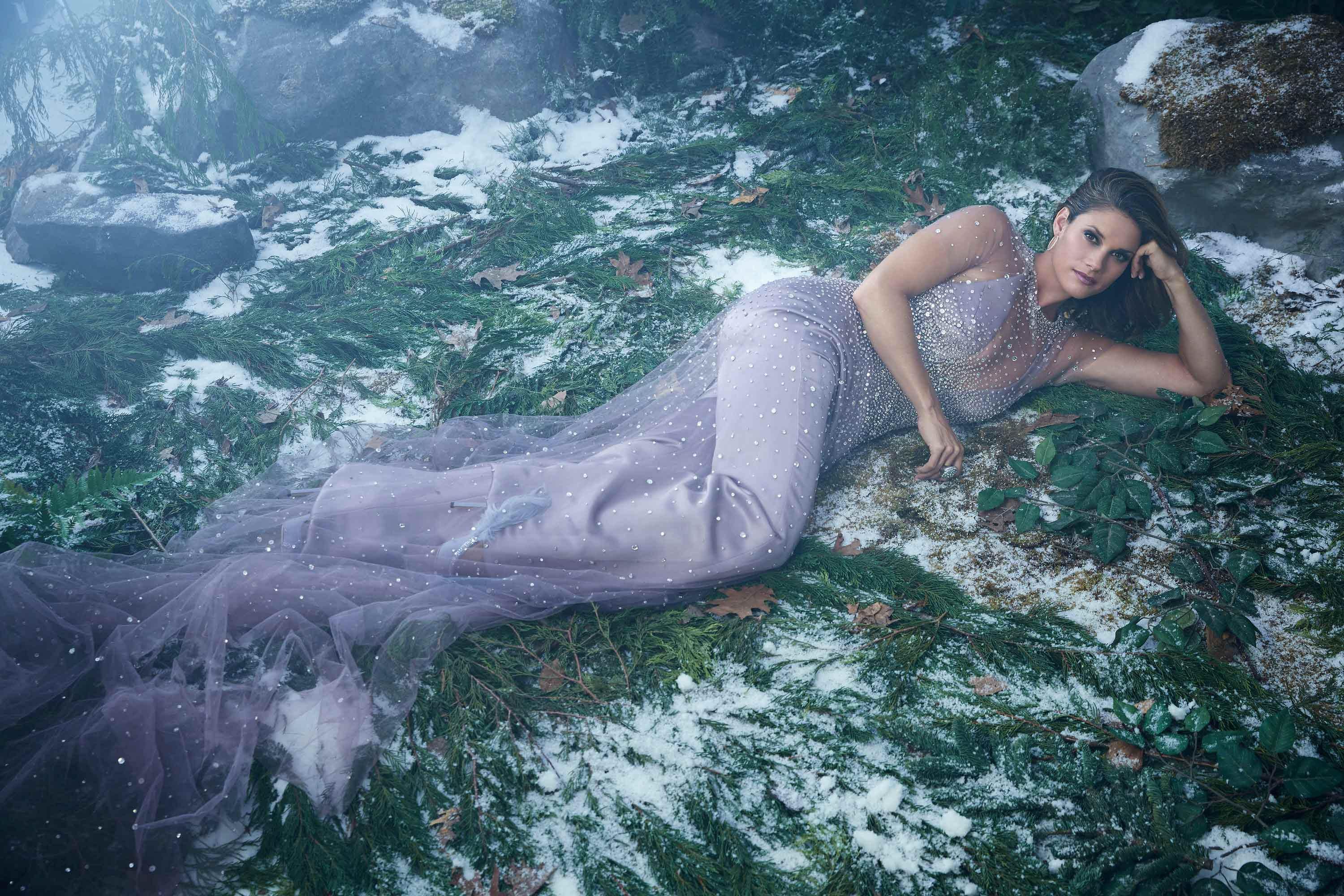 \u200bMissy Peregrym reclines in a sparkly lavender gown