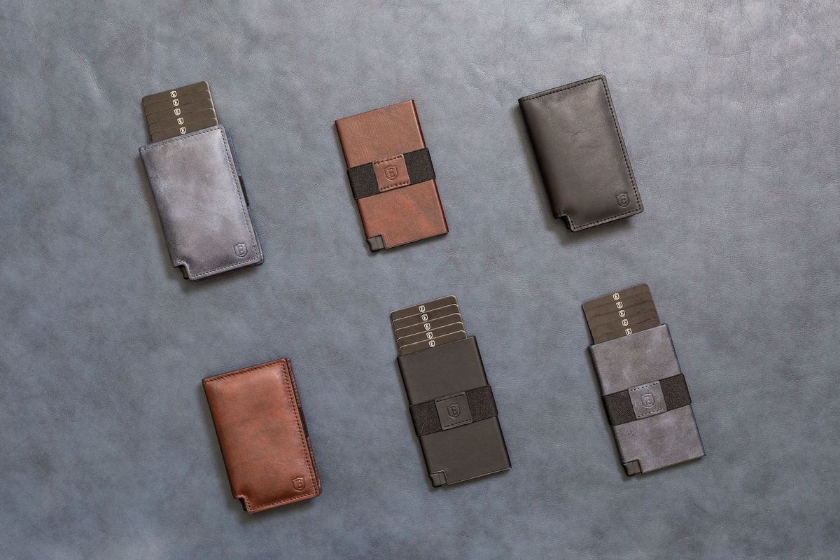 Ekster wallets laid out on a grey background
