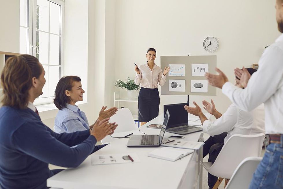 Coworkers celebrate meeting their 