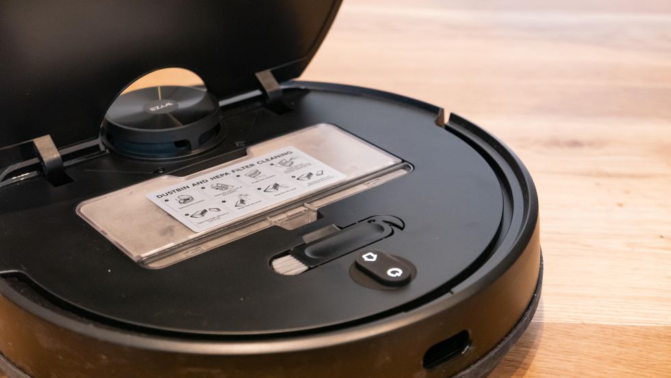 The dust bin and cleaning tool of the Wyze Robot Vacuum