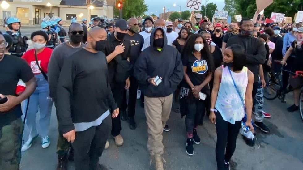 Kanye West marching with protestors in Chicago