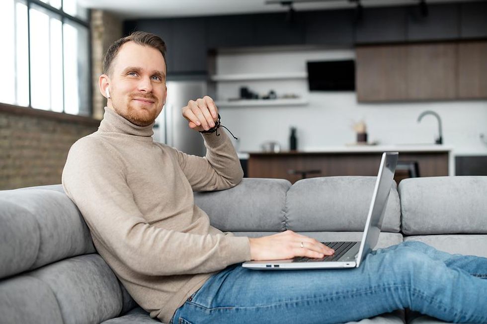 Man with a flexible work schedule works from home