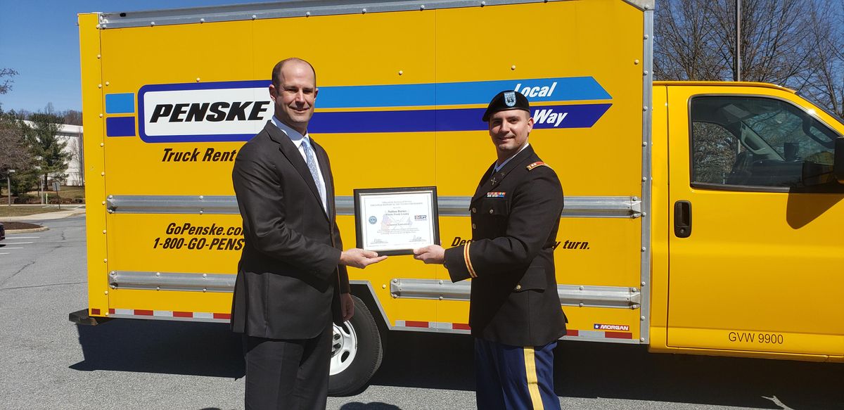 patriot award given in front of penske truck