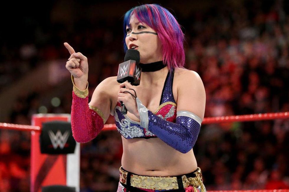Asuka cutting a promo in the ring