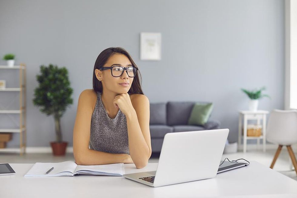 Woman thinks about messaging a LinkedIn connection