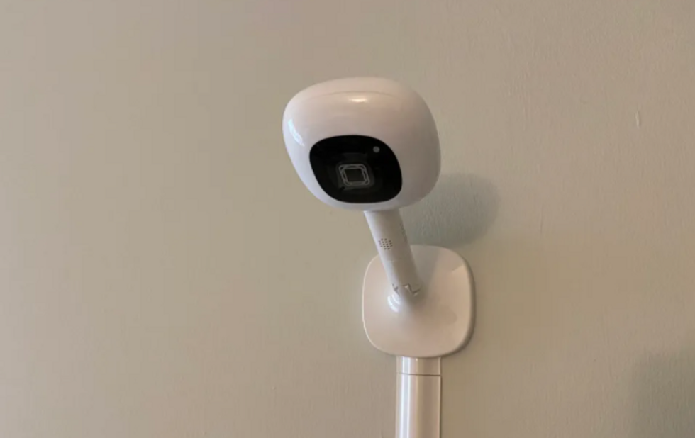 a photo of nanit pro camera mounted on the wall