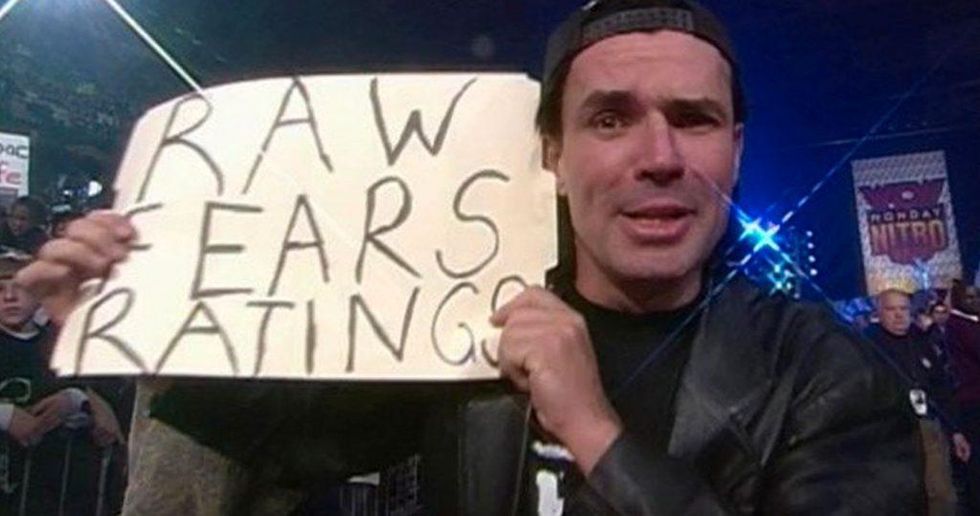 Eric Bischoff holding a sign that reads "Vince Fears Ratings"