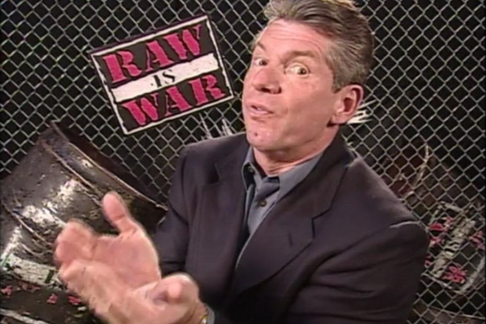 Vince McMahon holding his hands together iduring a promo