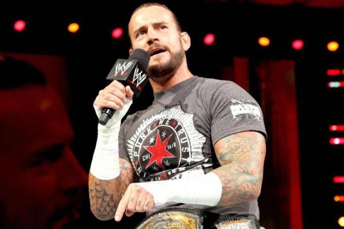 CM Punk in the ring holding a microphone