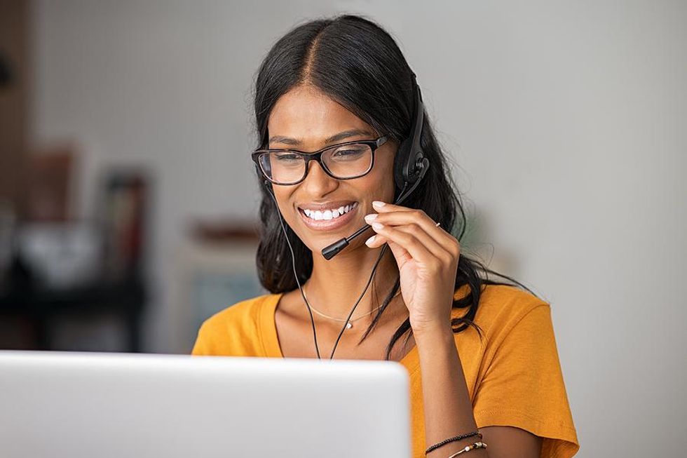 Remote worker talks to a customer on the phone