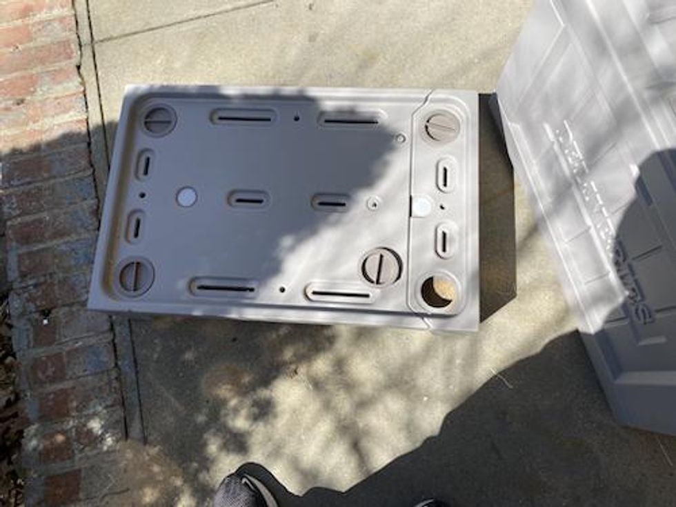 Yale Smart Delivery Box's base being filled with sand.