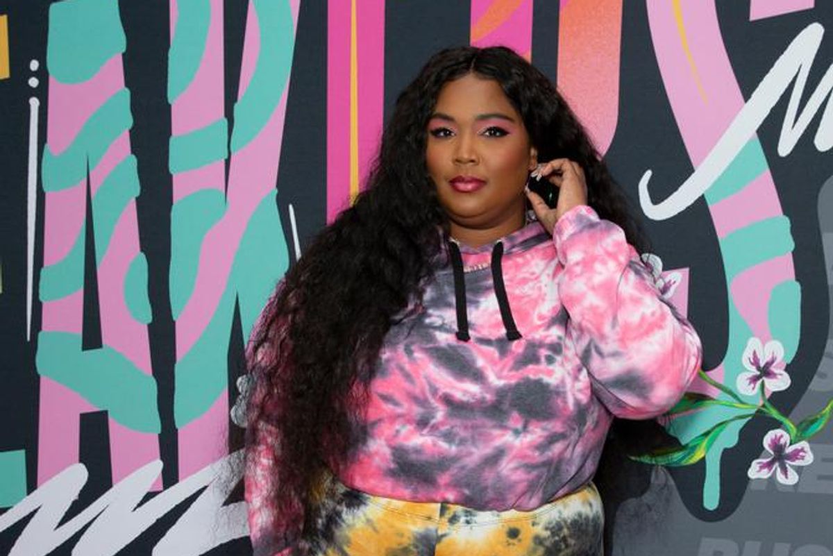 Literally Just Here to Show You Lizzo With Tons of Tiny Flowers in Her Hair  — See Photos