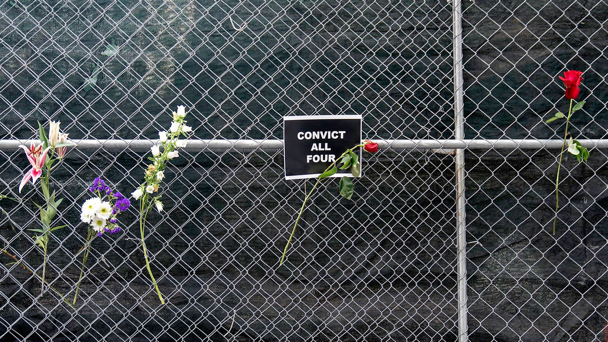 "Convict All Four" sign at the Hennepin County Government Center in Minneapolis, Minnesota.