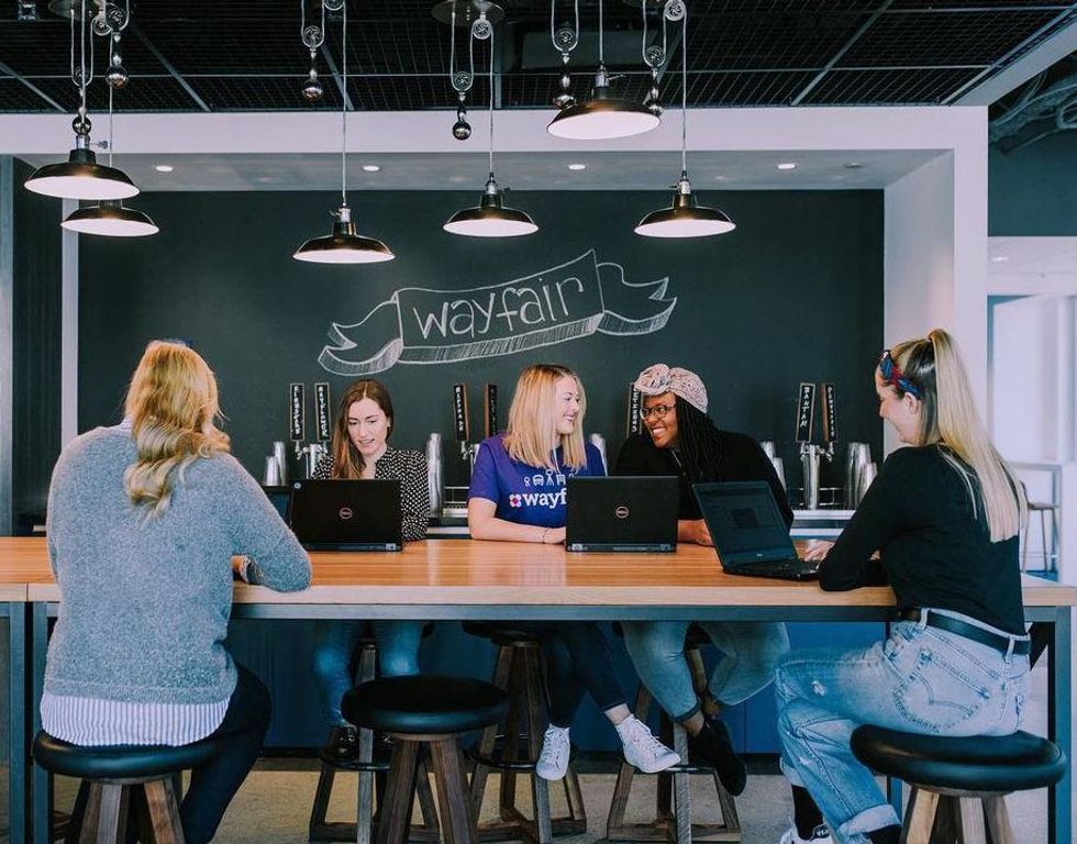 Wayfair employees collaborate at the company's headquarters.