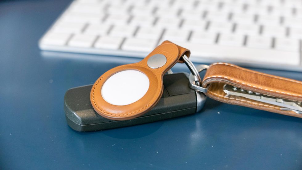 Apple AirTag inside Apple's leather keyring holder
