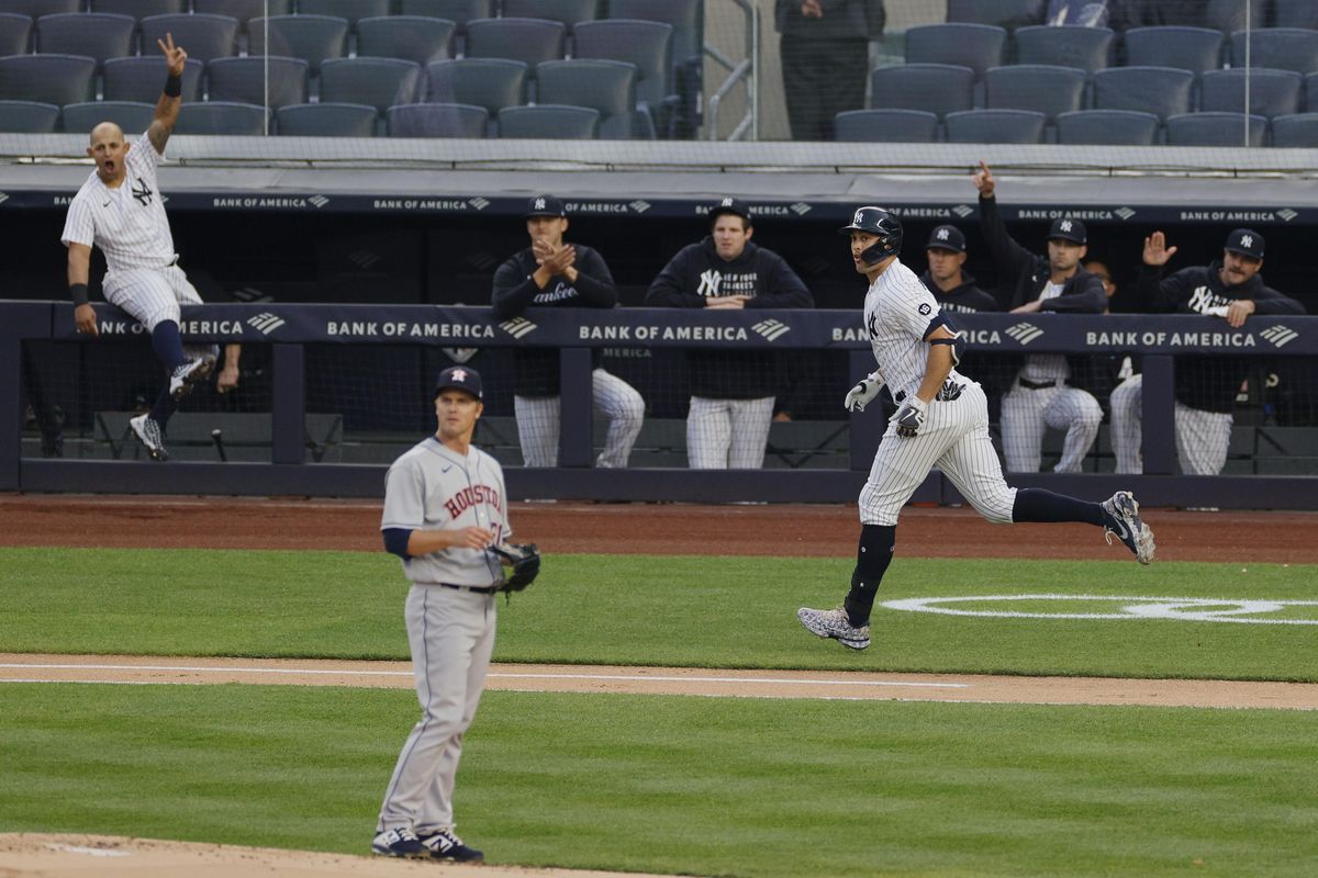 Yankees' Giancarlo Stanton celebrates a home run off of Astros' Zack Greinke