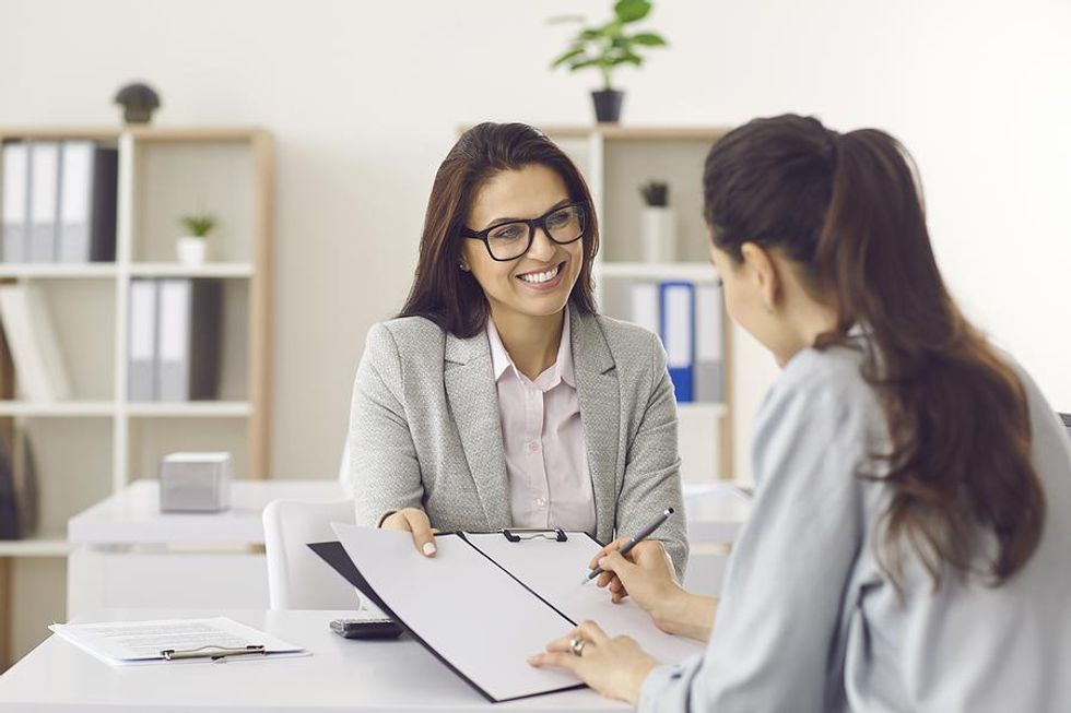 Hiring manager offers the job to a female job candidate