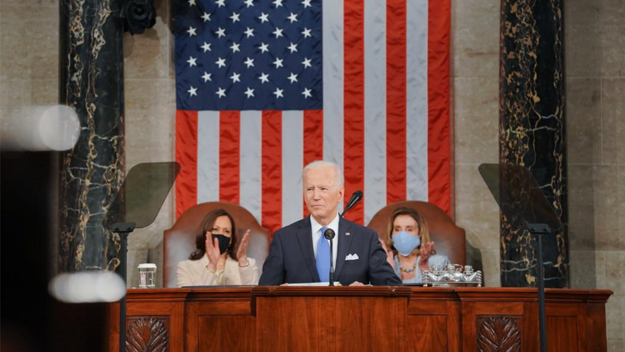 President Biden speaking at his first Congressional address in front of Vice President Harris, left, and House Speaker Pelosi. 