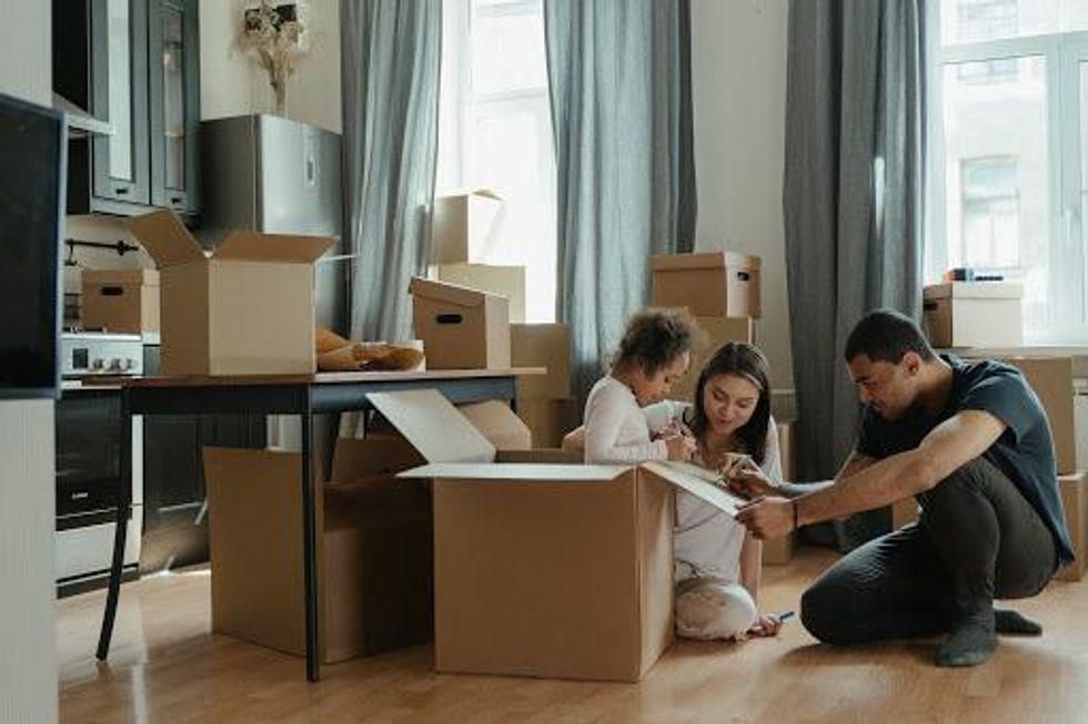 family unpacking boxes