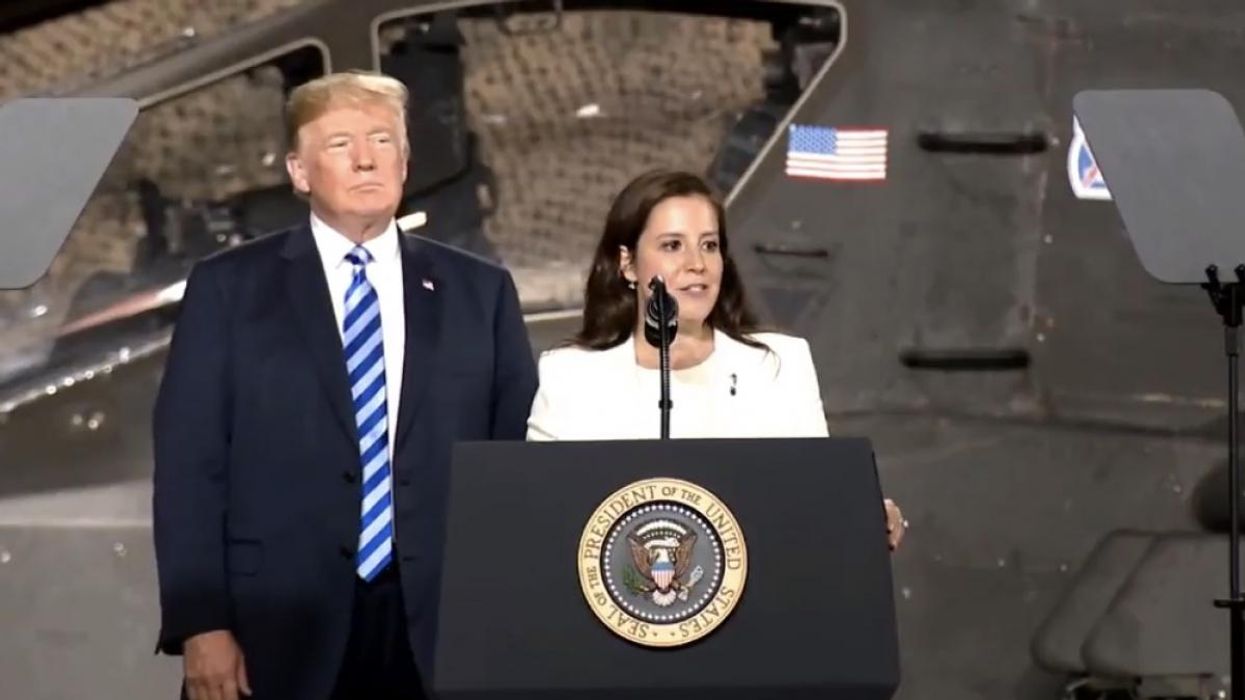 Rep. Elise Stefanik, right, speaking next to former President Trump.